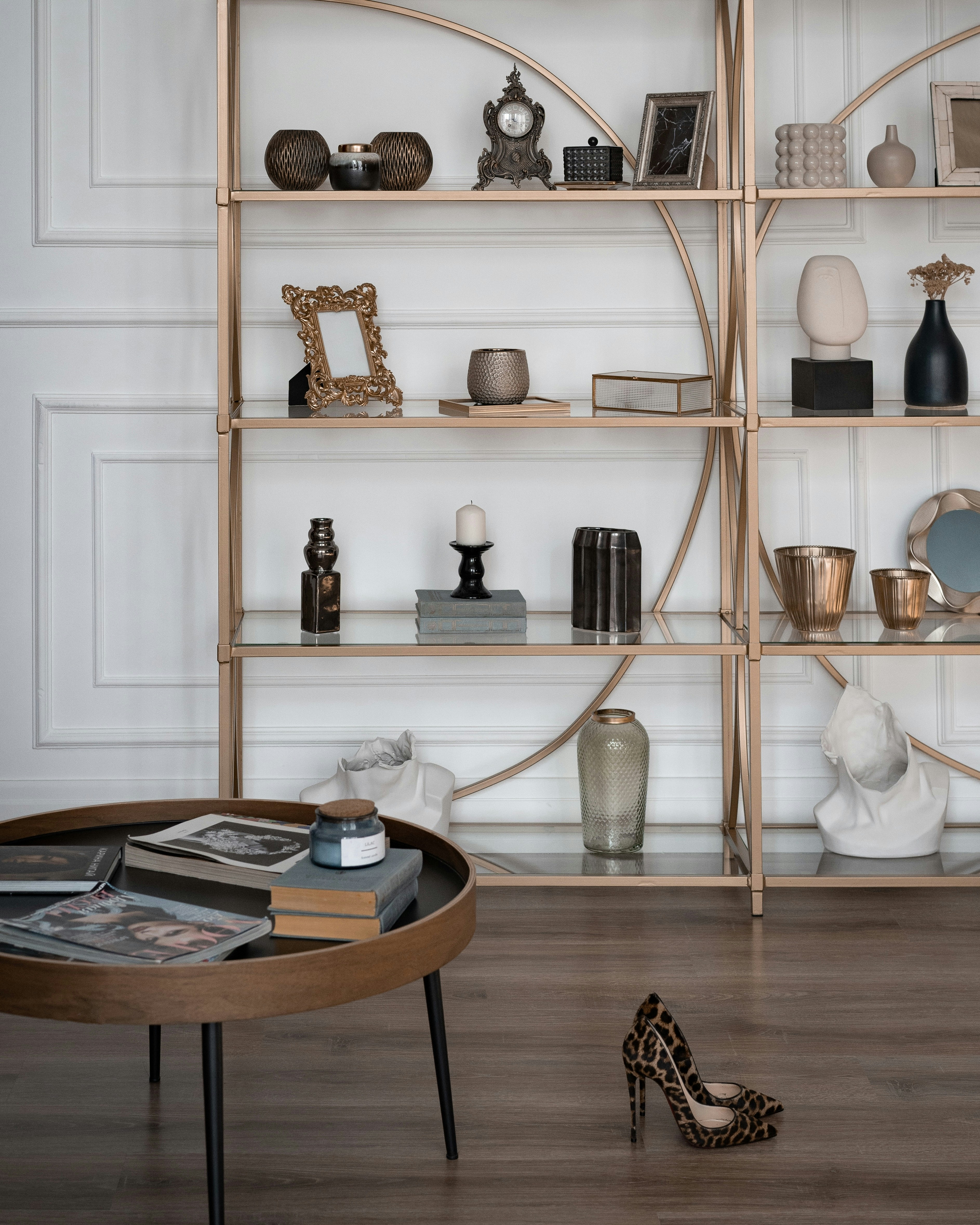 a white shelving unit with objects on it