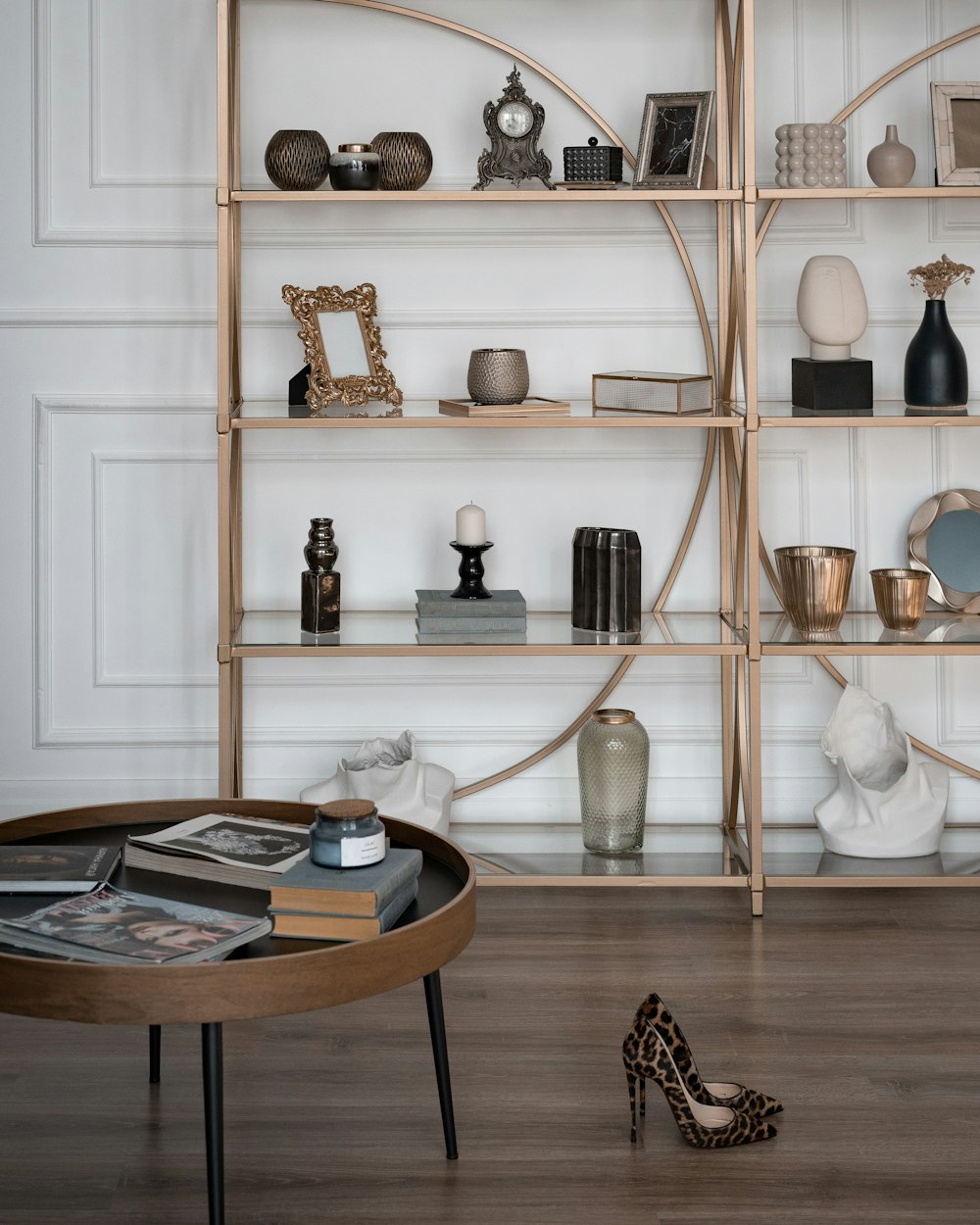 a white shelving unit with objects on it