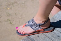 a woman's feet wearing sandals