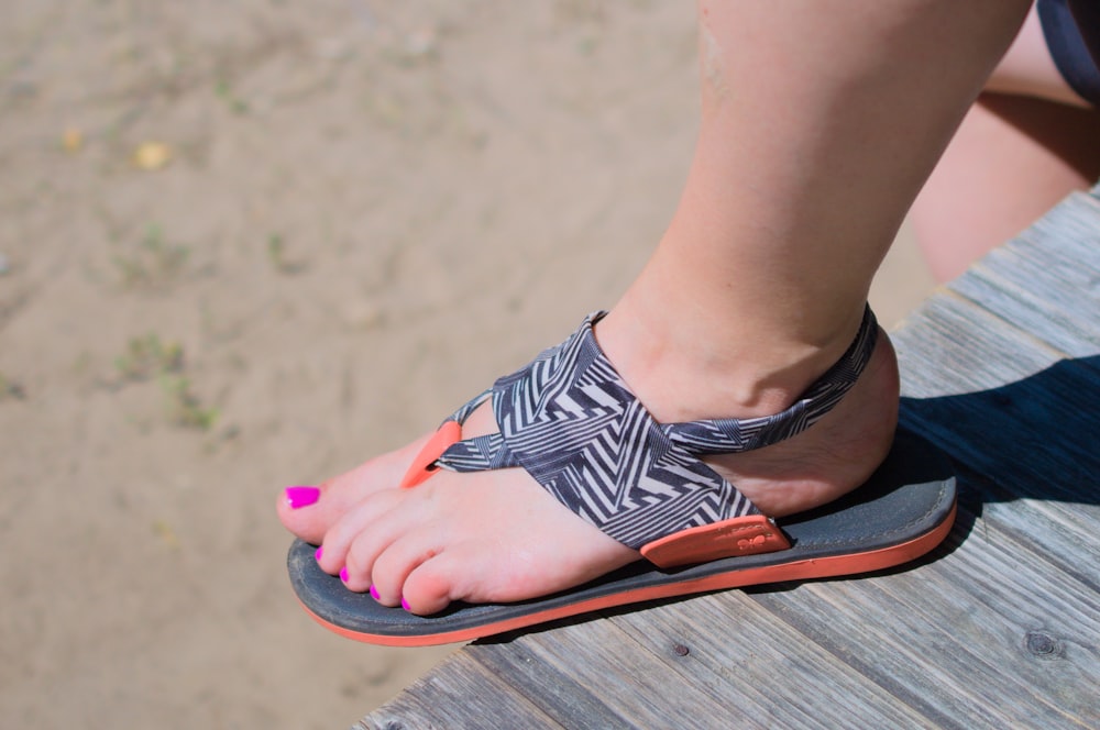 a woman's feet wearing sandals