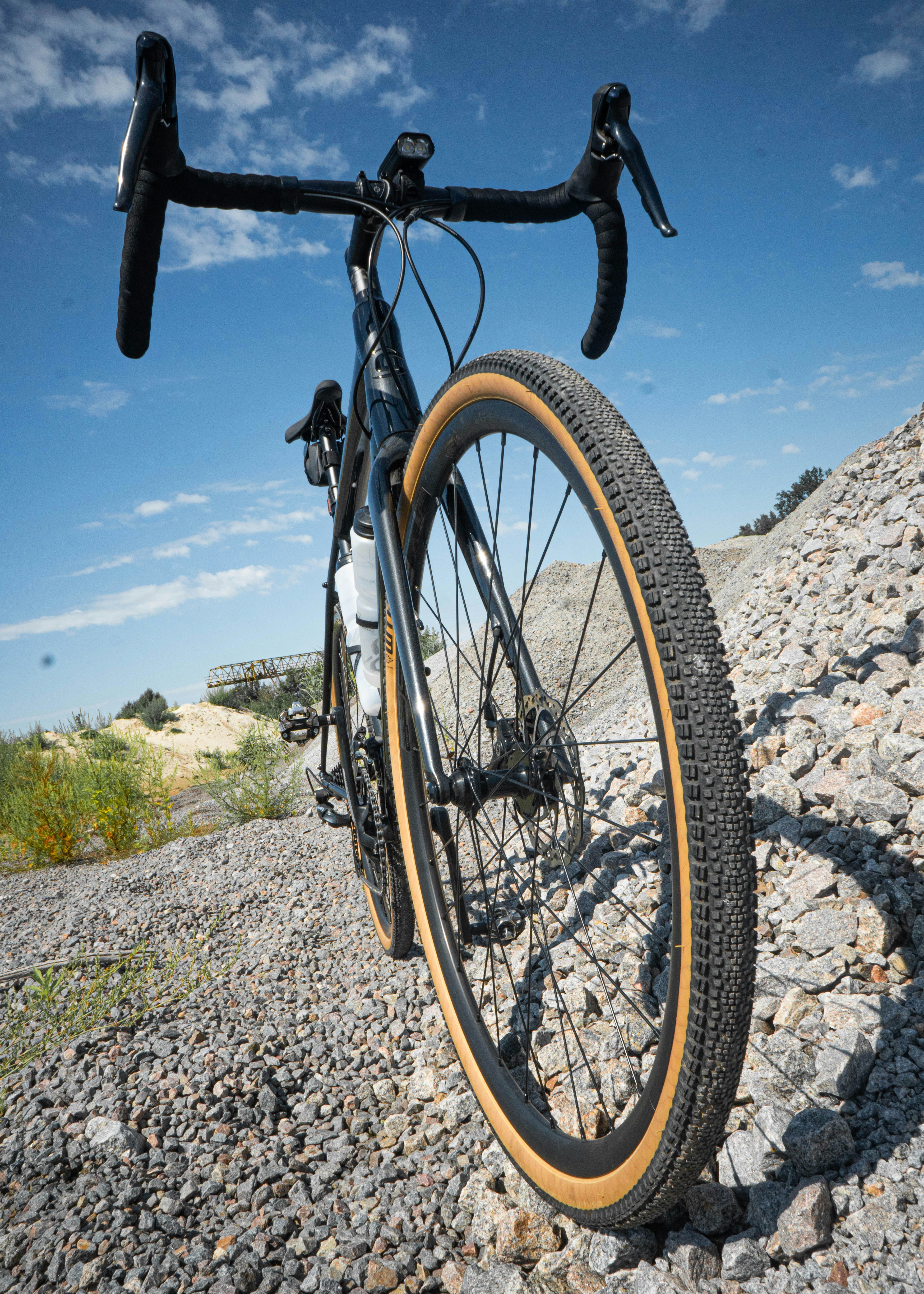 a bicycle parked on a rocky surface