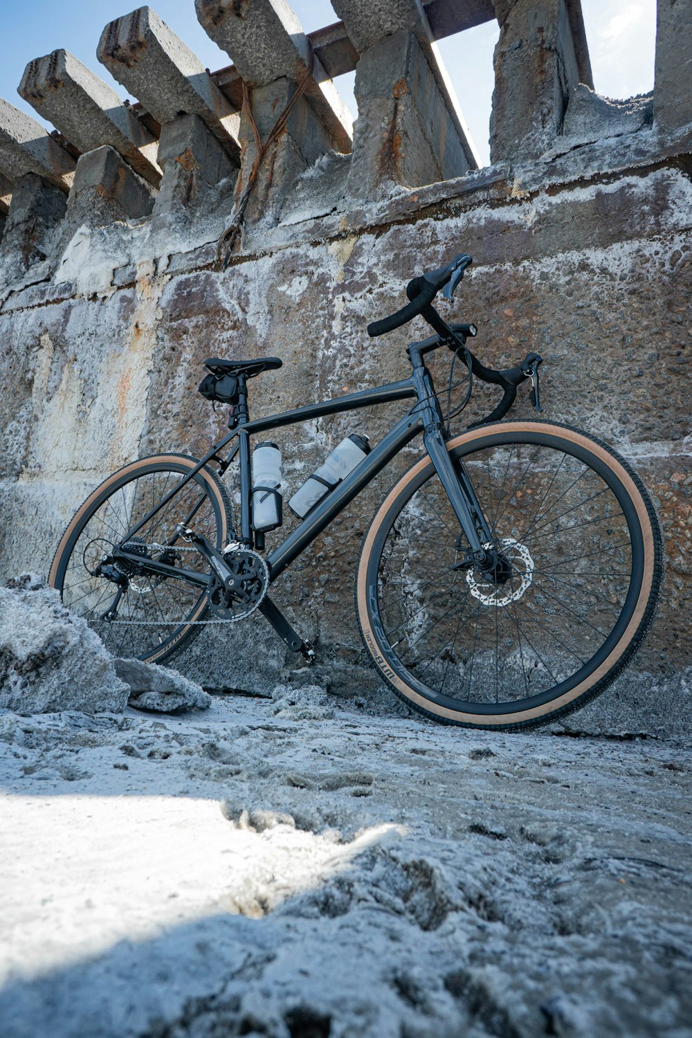 a bicycle parked on a rocky surface