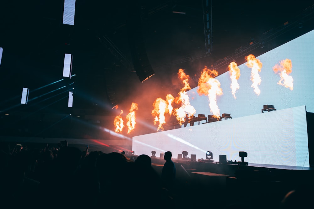 a stage with a large crowd watching