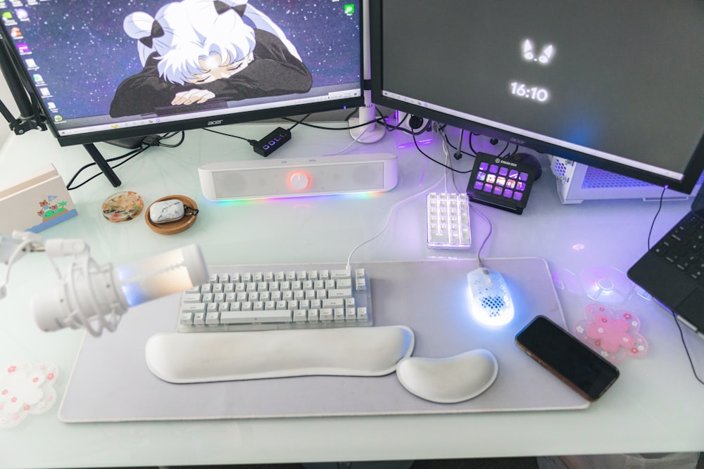 a desk with a computer and a keyboard