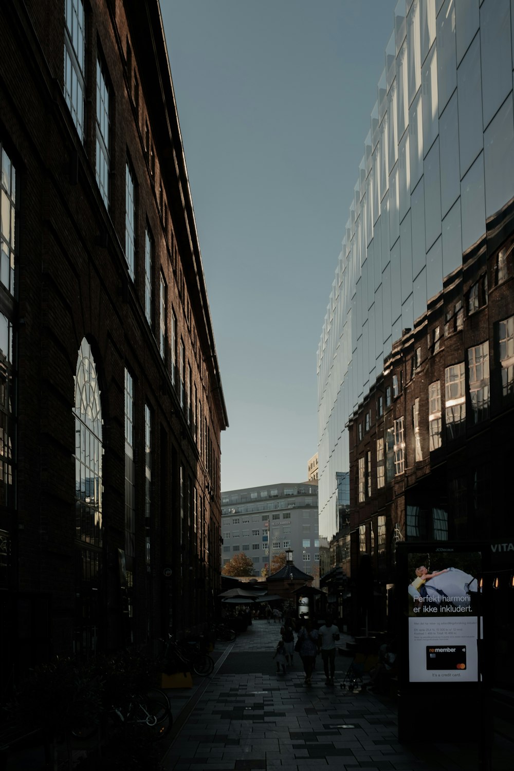 a city street with people walking