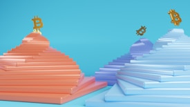 Stacked geometric shapes resembling pyramids in coral and purple hues with golden Bitcoin symbols floating above them. The background is a bright cyan color, creating a modern and abstract feel.