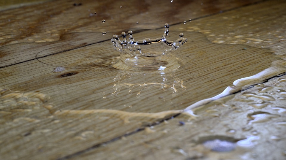 Water drips on a hardwood floor