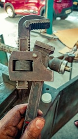 a hand holding a metal object