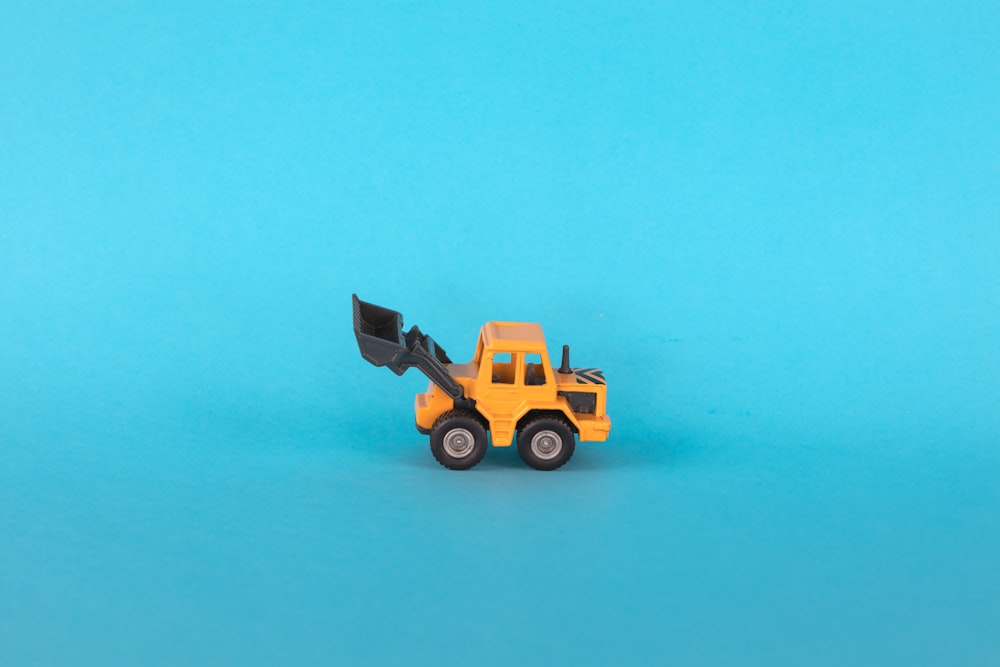 a toy truck on a blue background
