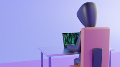 A 3D-rendered figure sits at a table, typing on a laptop with green code on the screen. The environment is minimalist and features soft lighting with a pastel color scheme.