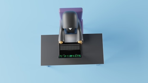 A 3D-rendered character is sitting at a desk using a laptop. The character appears simplified and cartoon-like, viewed from above. The desk is dark-colored with a laptop showing a grid and green digits, suggesting a futuristic or digital theme.