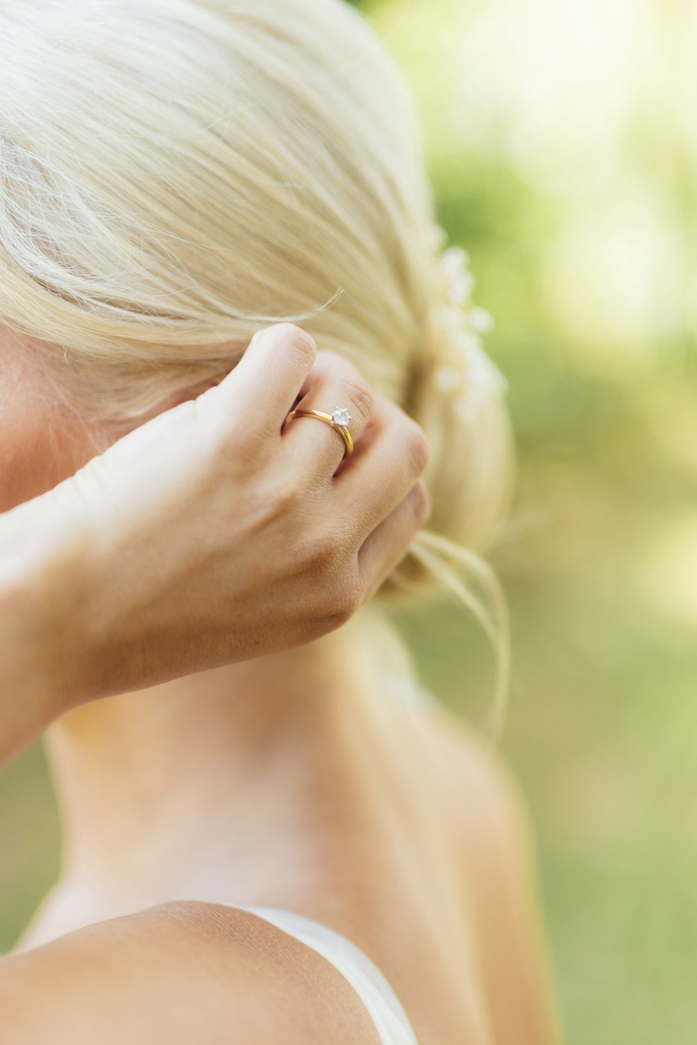 a woman's hand with a ring on her finger