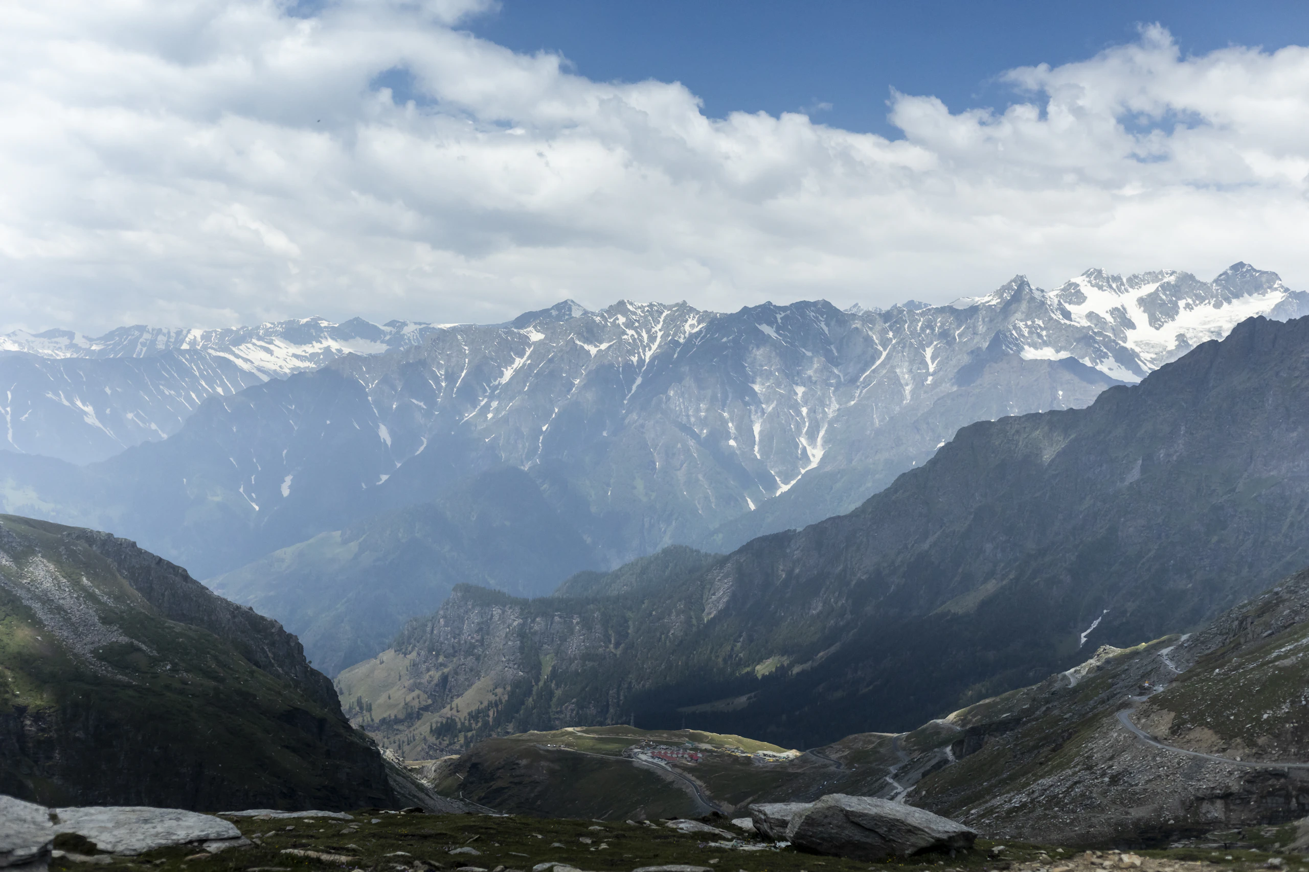 Snow-covered mountain range along the high-altitude Rohtang Pass road in Himachal Pradesh