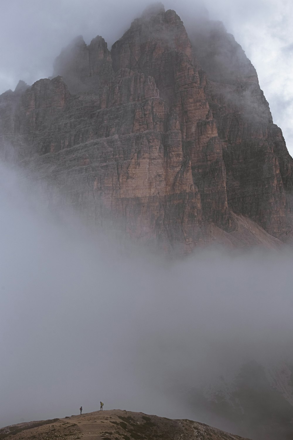 a mountain with fog around it