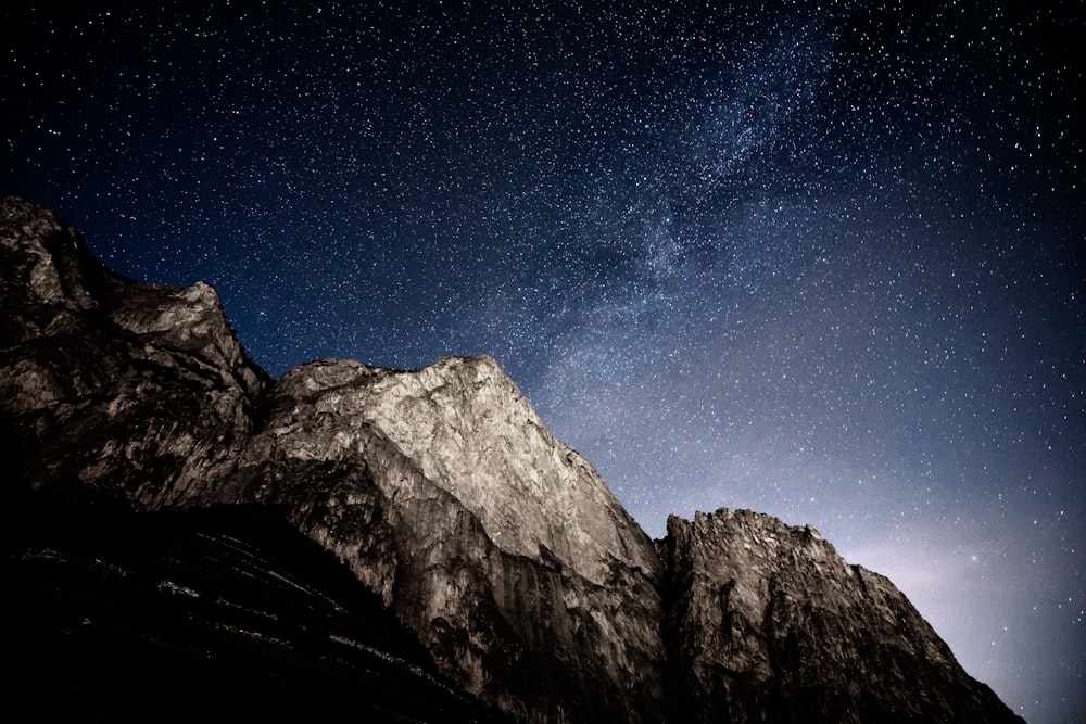 a mountain with a starry sky above