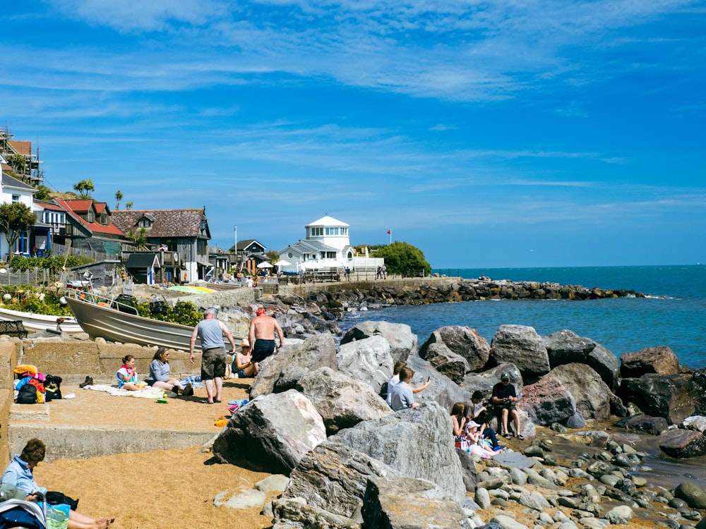 a group of people on a rocky beach