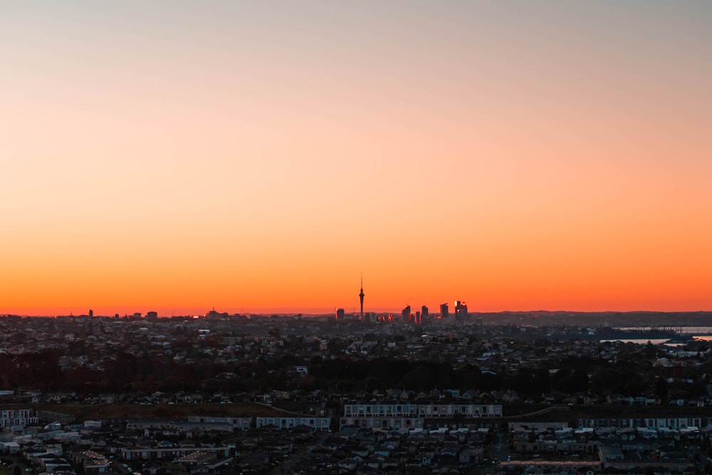 a city with a sunset in the background