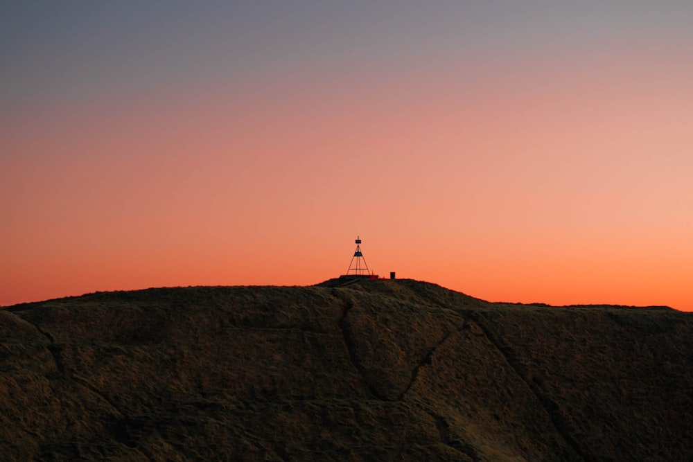 a person standing on a hill