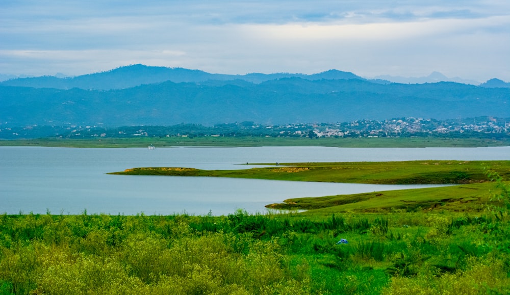 a body of water with land in the back