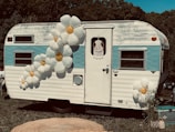 a white van with flowers on the roof