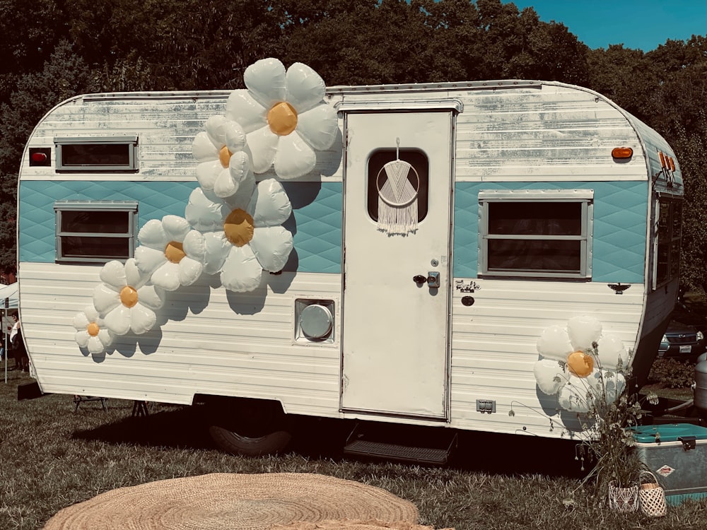 a white van with flowers on the roof