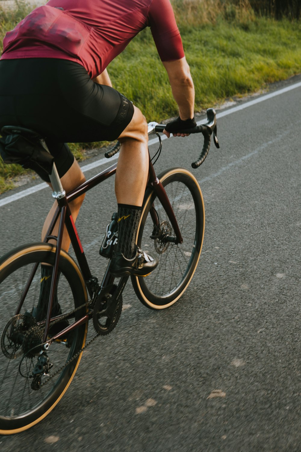 a person riding a bicycle on a road