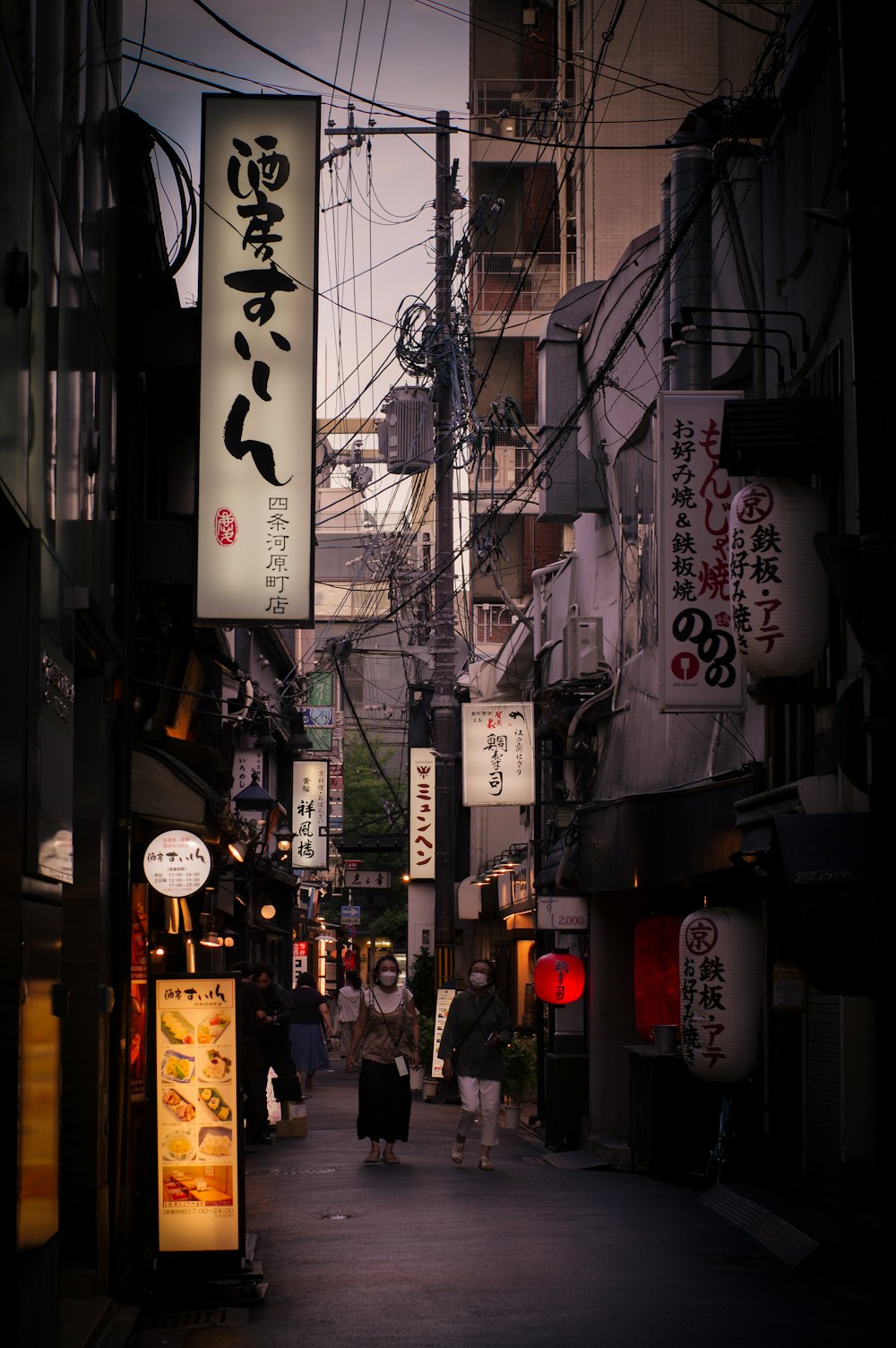 people walking down a street