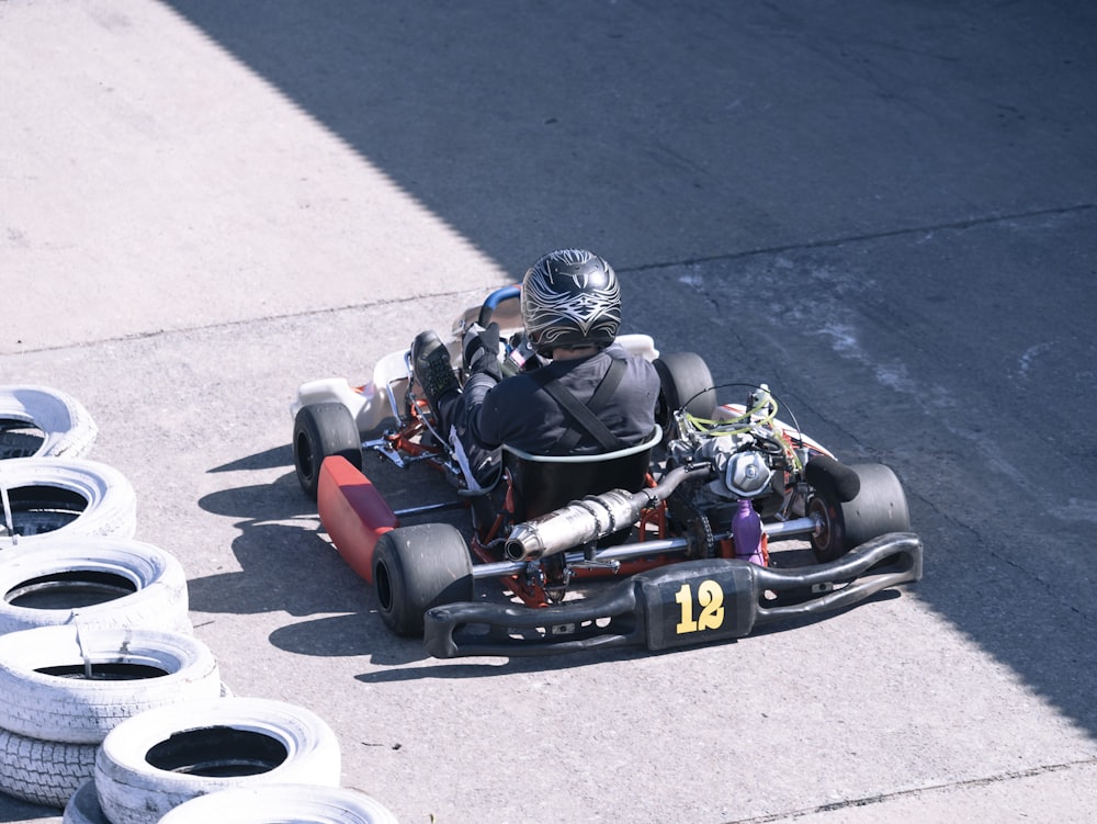 a person driving a go kart