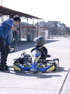 a man and a child on a go kart