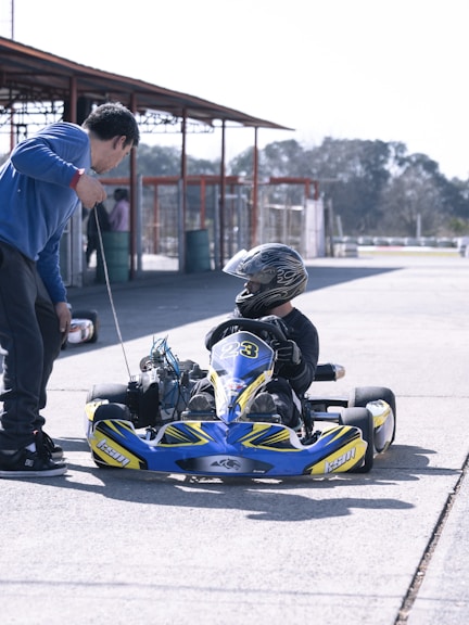 a man and a child on a go kart