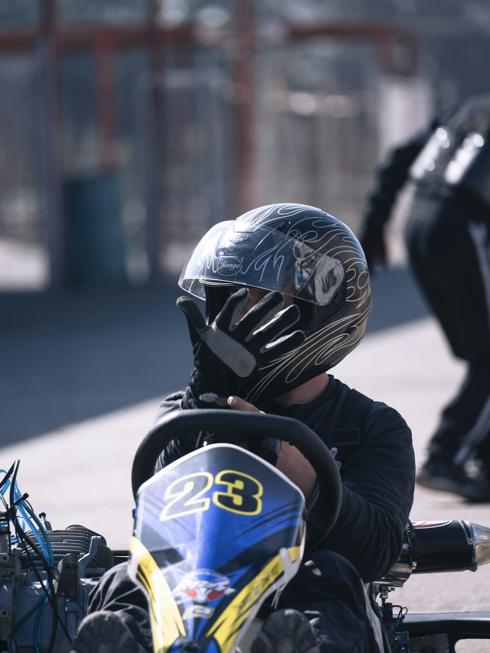 a person wearing a helmet and riding a motorcycle
