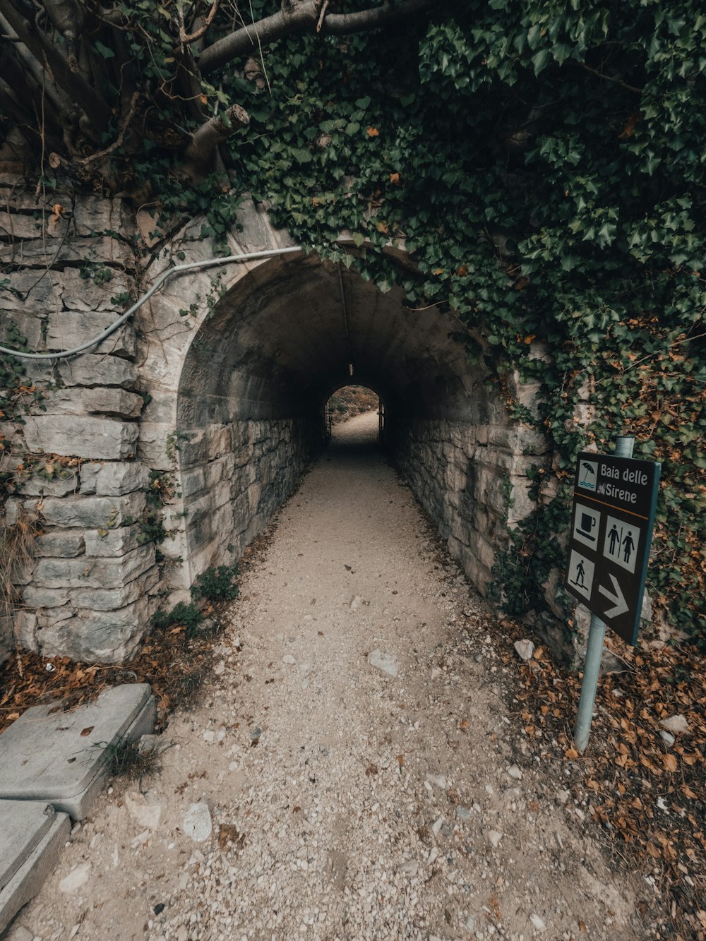 a tunnel with a sign