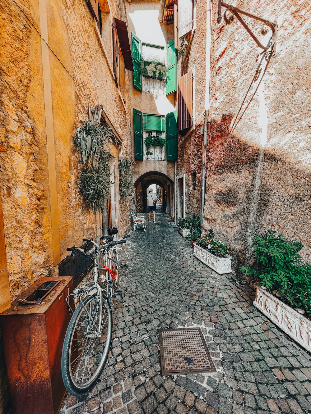a bicycle parked in an alley