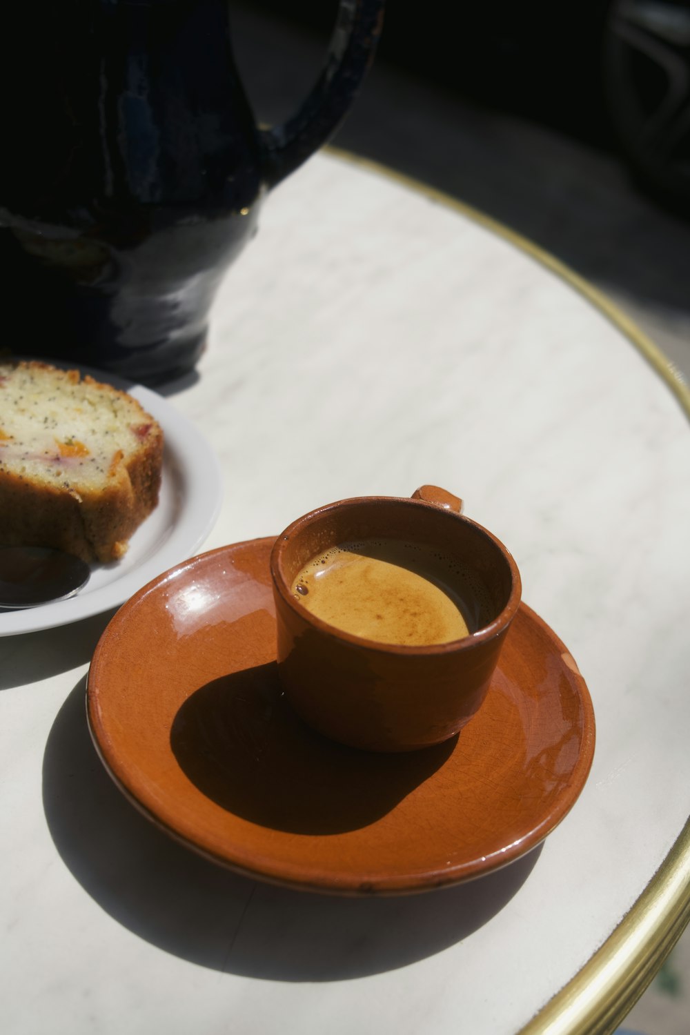 a cup of coffee on a saucer