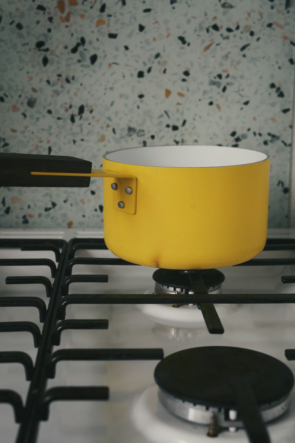 a yellow pot on a table