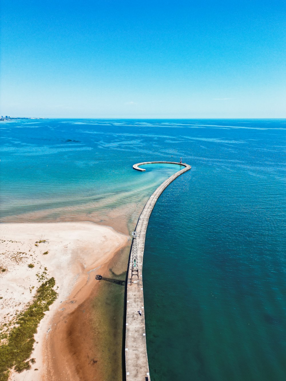 a road next to a body of water