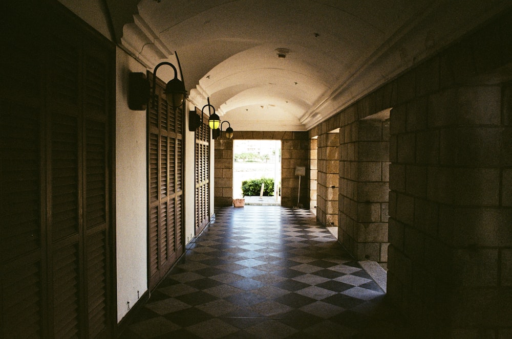 a hallway with stone walls