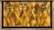 A decorative wall features a geometric patterned background with a warm golden hue. Mounted metal frames hold several small potted plants with lush green foliage, arranged symmetrically. The design blends natural elements with modern art deco style.