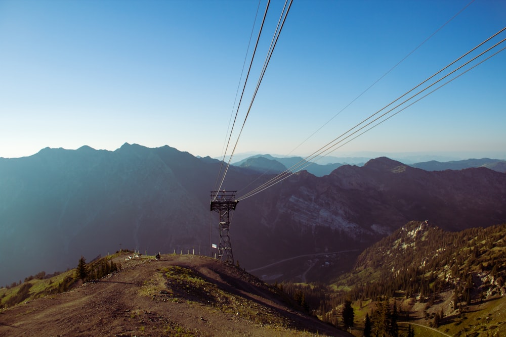 a power line tower in the mountains