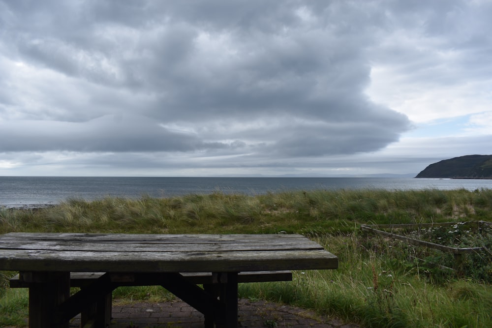 a picnic table overlooking the ocean