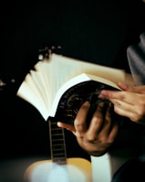 a person holding a guitar