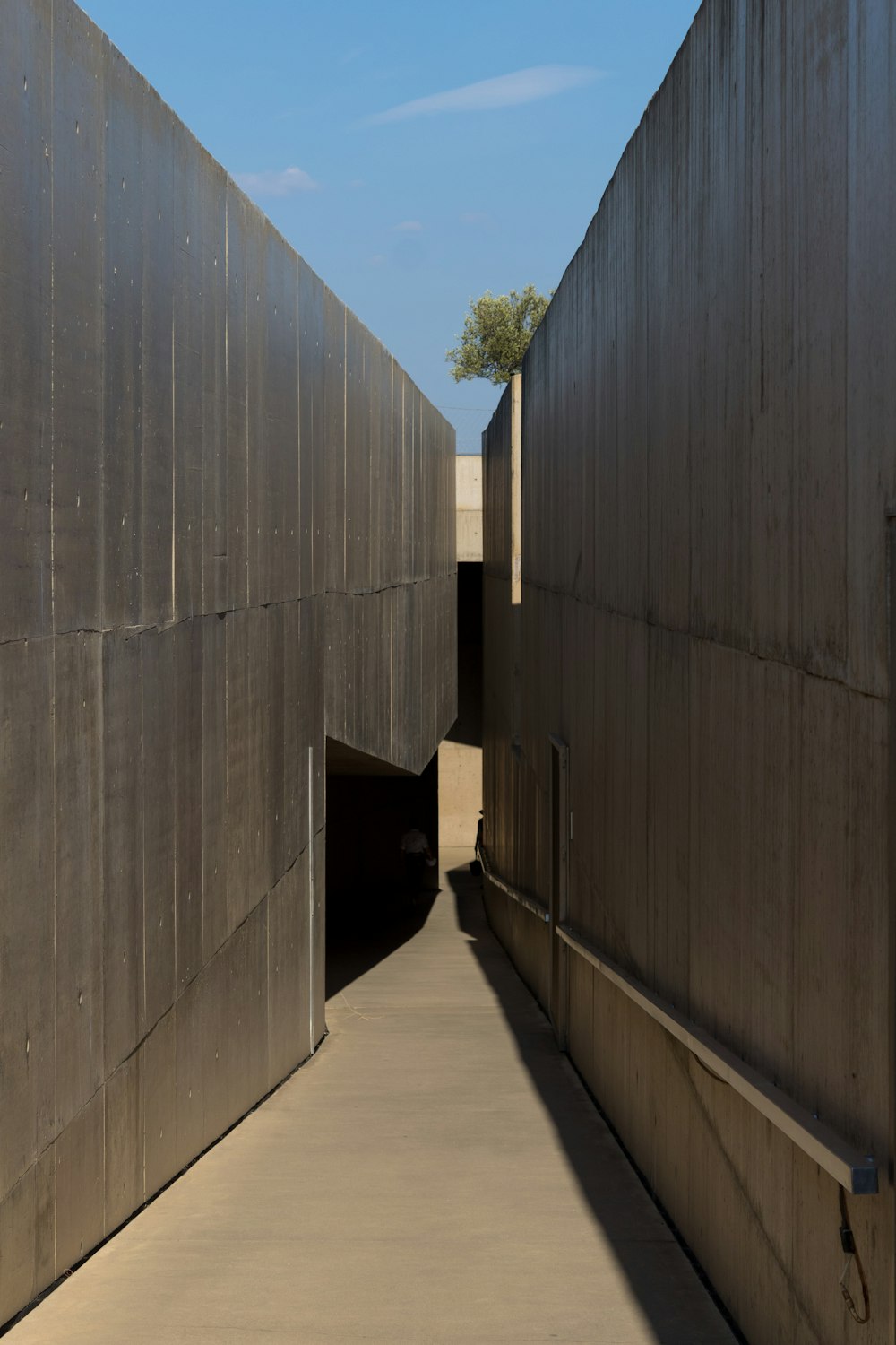a long hallway between two large metal walls
