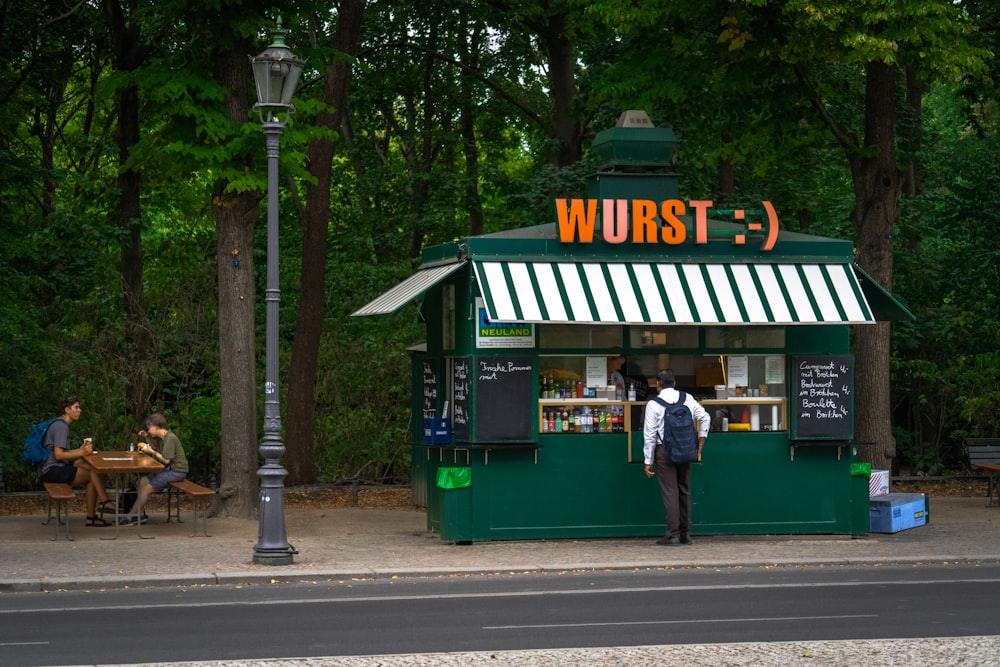 a person standing in front of a restaurant