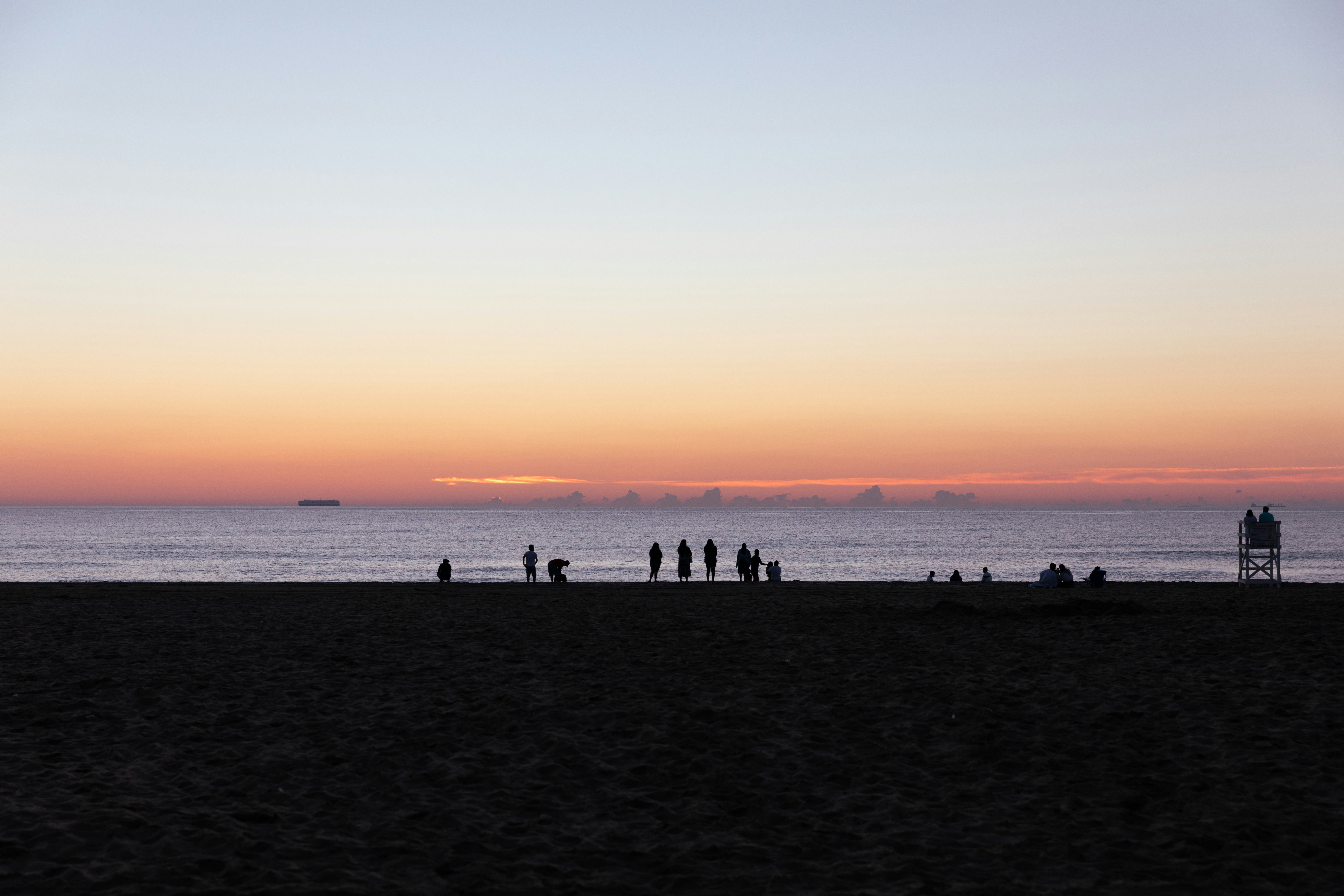 a group of people on a beach