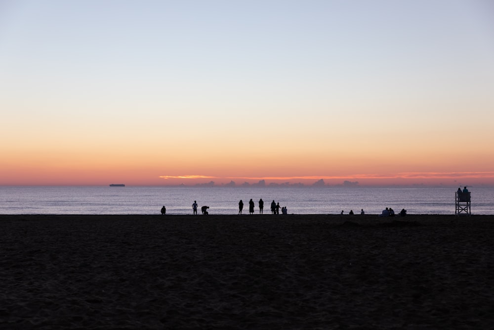 a group of people on a beach