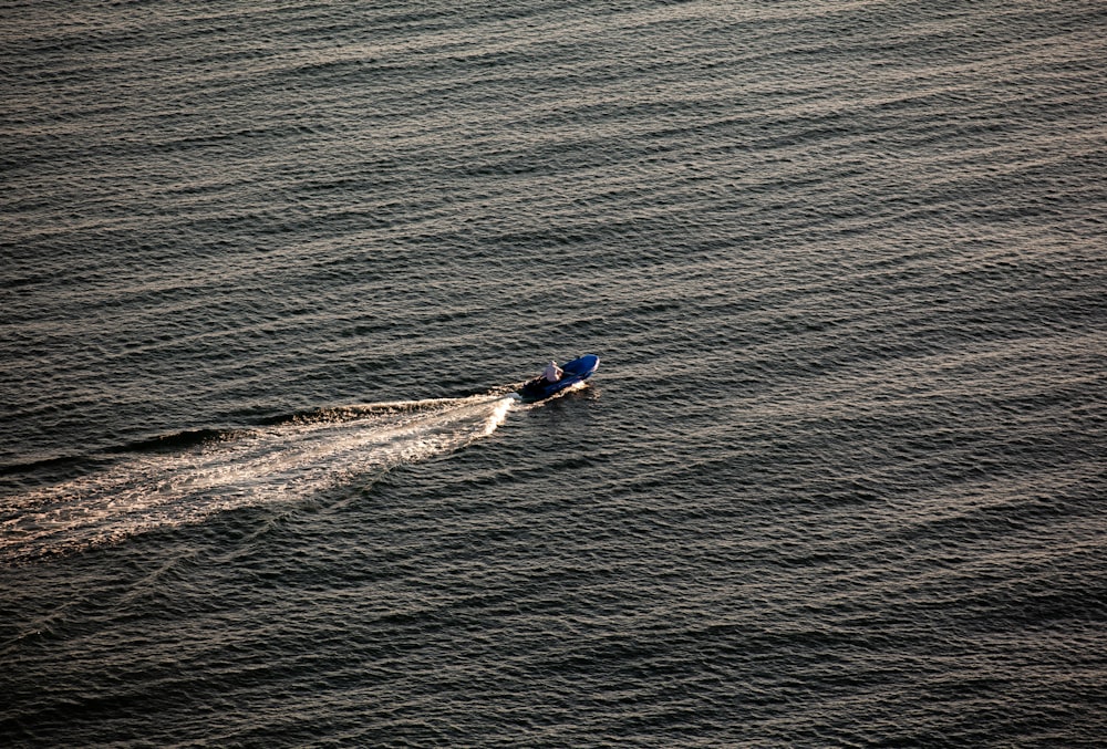 a person in a boat on the water