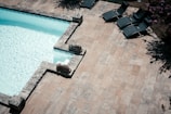 a pool with chairs around it