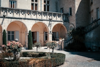a building with a garden in front