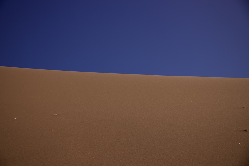 a large flat area with a blue sky