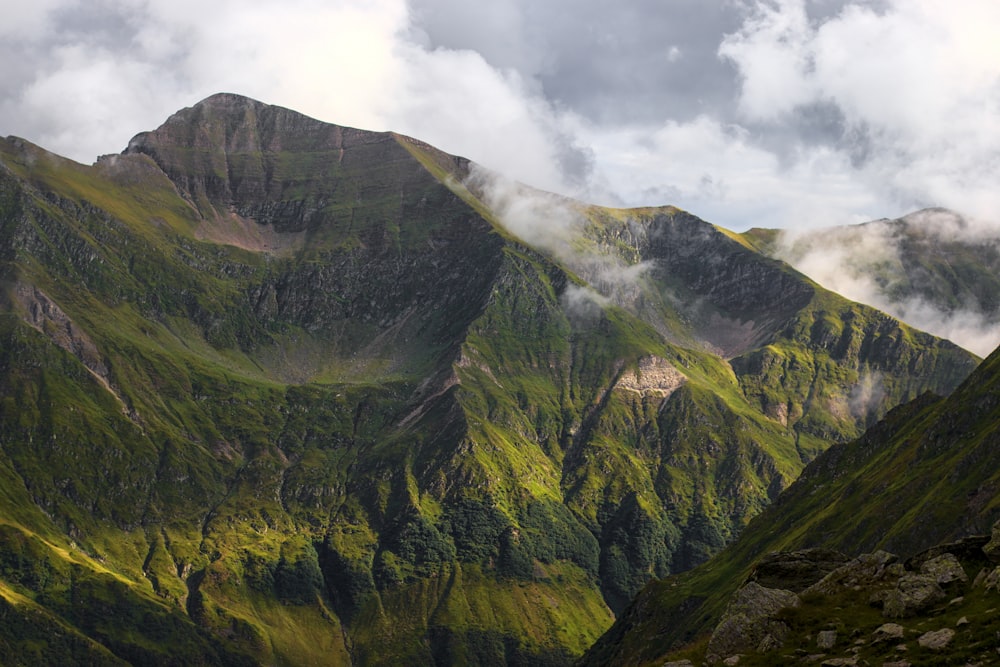 a mountain with clouds